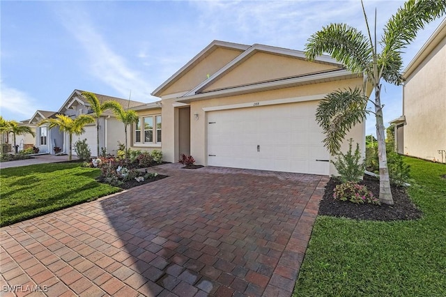 single story home featuring a garage and a front lawn