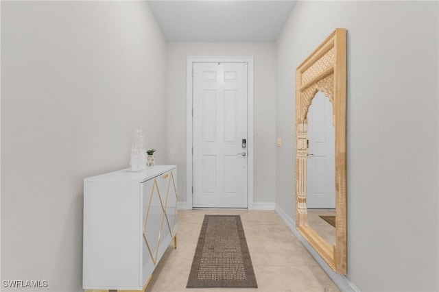 entryway with light tile patterned floors