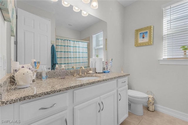 bathroom with a shower with curtain, tile patterned floors, toilet, and vanity