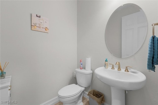 bathroom with sink and toilet