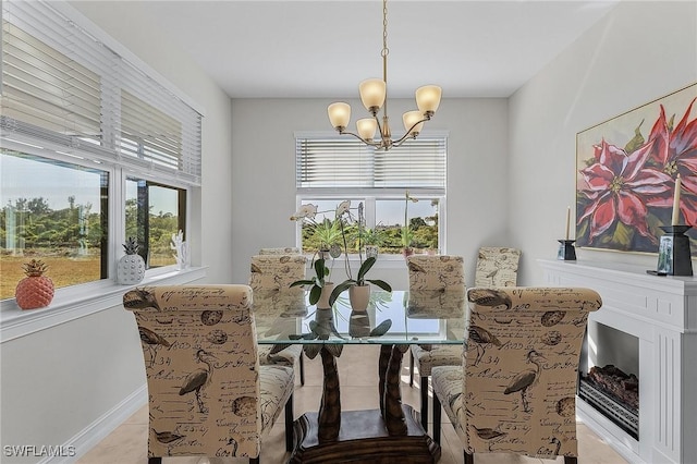 dining space with an inviting chandelier