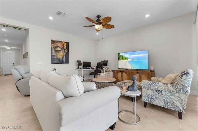 tiled living room featuring ceiling fan