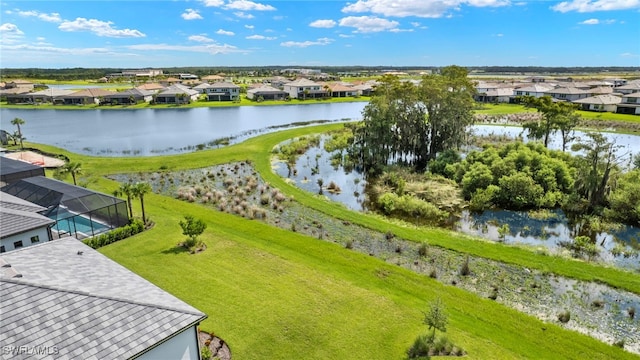 birds eye view of property with a water view