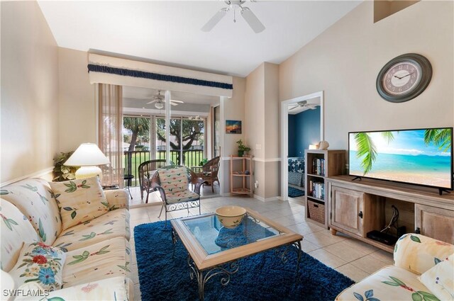 living room featuring light tile patterned flooring and ceiling fan