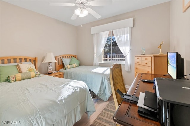 bedroom with ceiling fan and wood finished floors