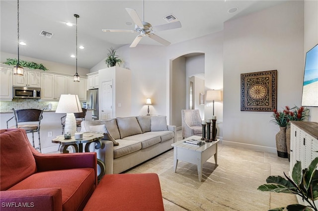 living room featuring vaulted ceiling and ceiling fan