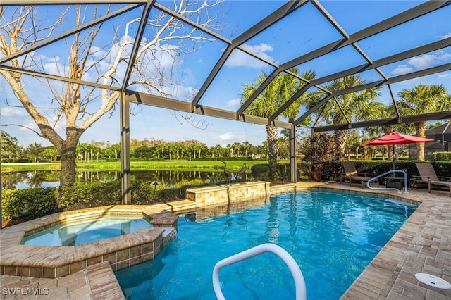 view of swimming pool with an in ground hot tub, pool water feature, glass enclosure, a water view, and a patio area