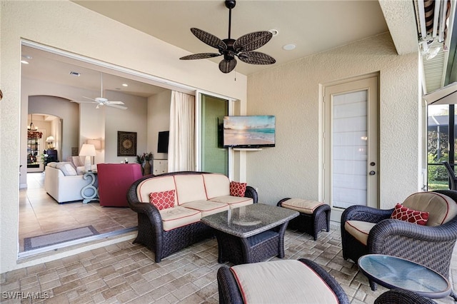 view of patio / terrace featuring outdoor lounge area and ceiling fan