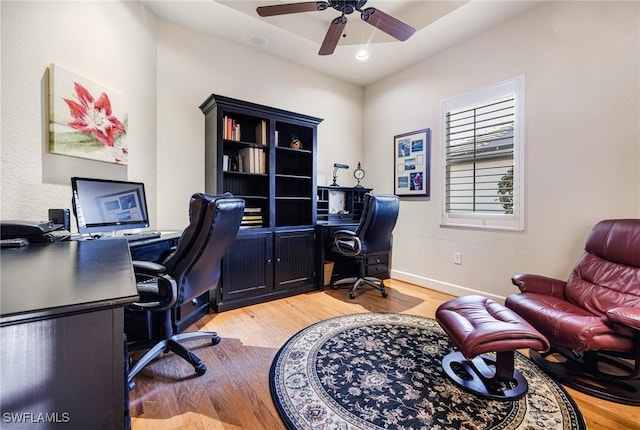 office area featuring light hardwood / wood-style flooring and ceiling fan