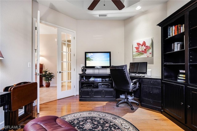 office with french doors, ceiling fan, and wood-type flooring