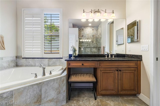 bathroom featuring vanity and shower with separate bathtub