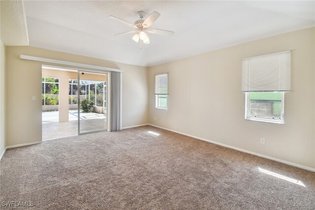 spare room with carpet floors and ceiling fan