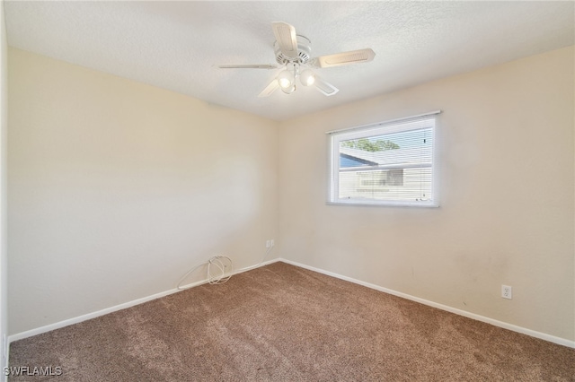 unfurnished room with ceiling fan, carpet flooring, and a textured ceiling