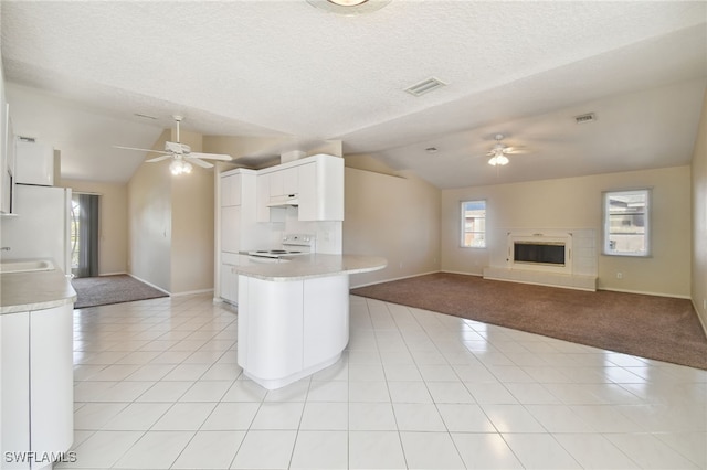 kitchen featuring light tile patterned flooring, white cabinetry, lofted ceiling, ceiling fan, and white appliances