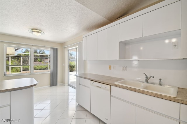 kitchen with white cabinetry, sink, dishwasher, and light tile patterned flooring