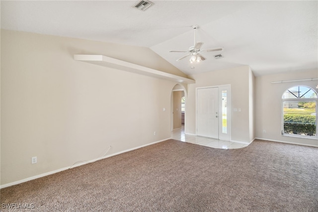 unfurnished living room with lofted ceiling, light colored carpet, and ceiling fan