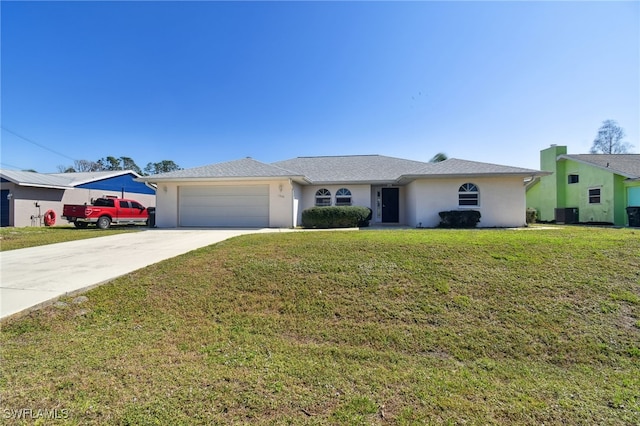 ranch-style home featuring cooling unit, a garage, and a front lawn