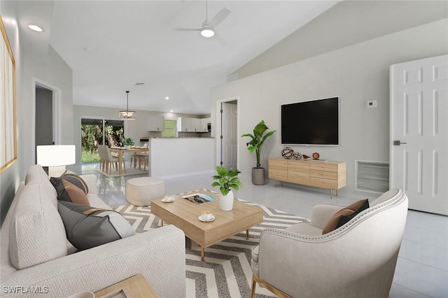 living room featuring ceiling fan and lofted ceiling