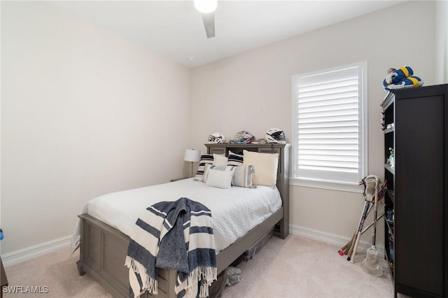 bedroom with light colored carpet and ceiling fan