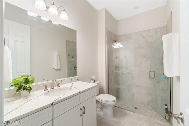 bathroom featuring vanity, an enclosed shower, tile patterned floors, and toilet