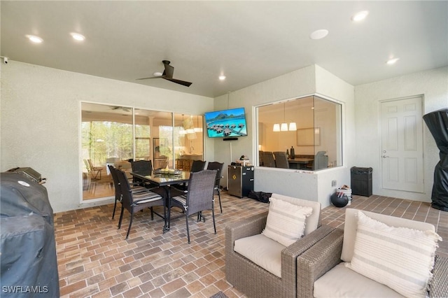 interior space with a grill and ceiling fan