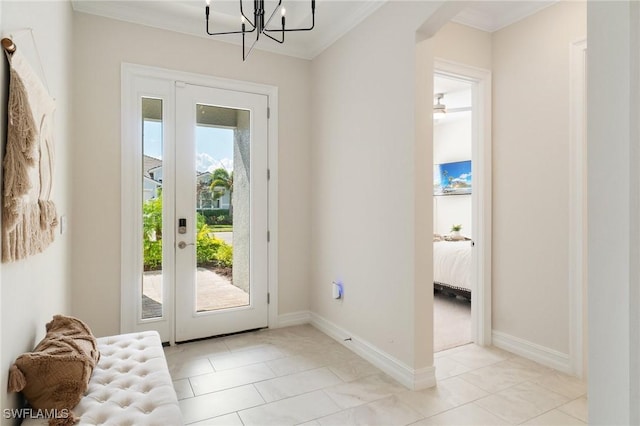 doorway with crown molding, light tile patterned floors, and a chandelier