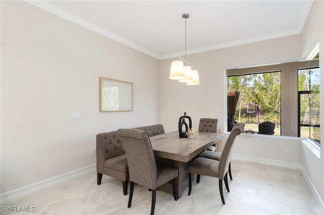 dining area featuring crown molding and light tile patterned floors