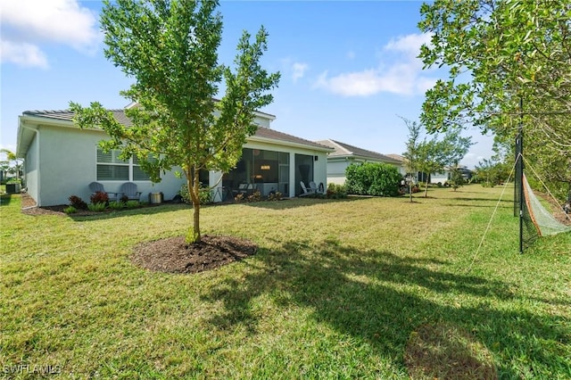 view of yard with a sunroom