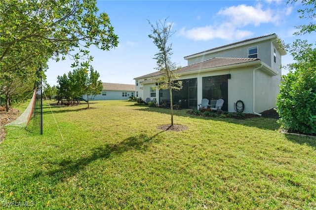 view of yard with a sunroom