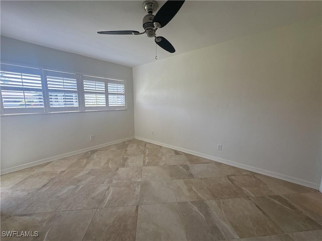 spare room with ceiling fan