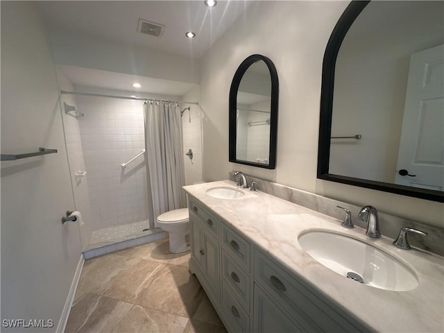 bathroom featuring vanity, toilet, and a shower with shower curtain