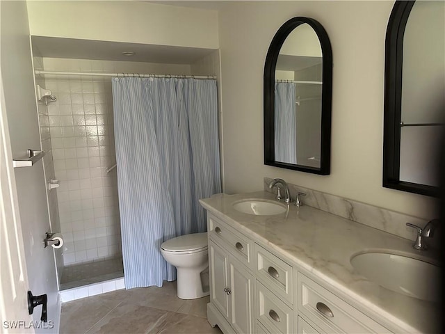 16521 Bayleaf Ln Unit 64, Fort Myers, FL 33908 - bathroom with toilet, tiled shower, double vanity, and tile patterned floors