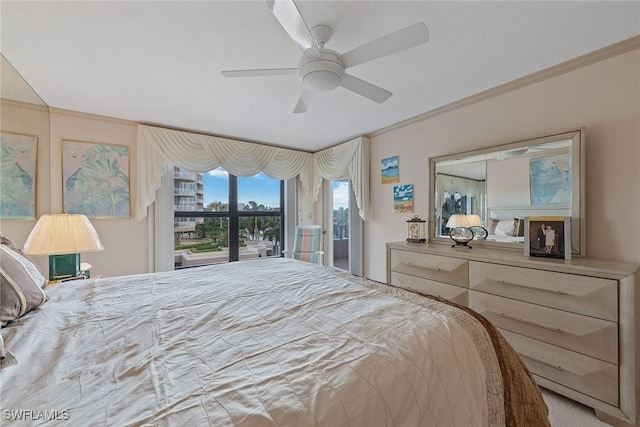 bedroom with ceiling fan, ornamental molding, and access to exterior