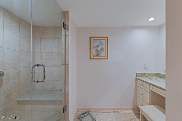 bathroom with vanity and an enclosed shower