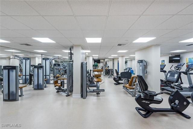 workout area with a paneled ceiling