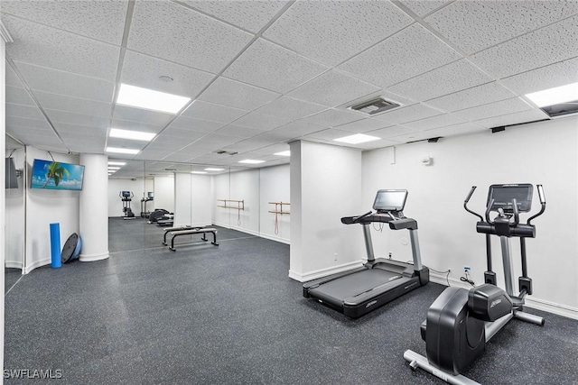 gym featuring a paneled ceiling