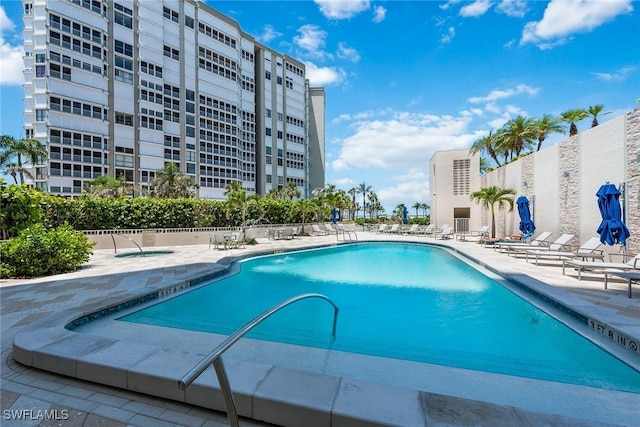 view of swimming pool with a patio area