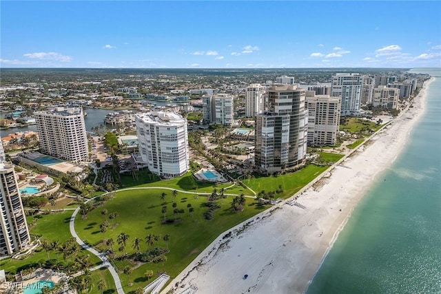 bird's eye view featuring a beach view and a water view