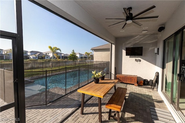 balcony featuring ceiling fan and a patio area