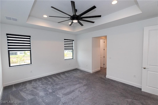 20341 Fair Oak Ln, Estero, FL 33928 - empty room featuring a raised ceiling, ceiling fan, dark carpet, baseboards, and recessed lighting