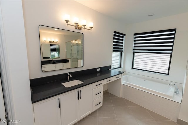 20341 Fair Oak Ln, Estero, FL 33928 - full bathroom with vanity, a garden tub, and tile patterned floors