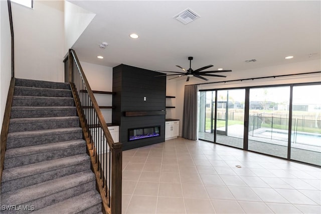 20341 Fair Oak Ln, Estero, FL 33928 - unfurnished living room featuring a fireplace, a ceiling fan, recessed lighting, stairway, and light tile patterned floors