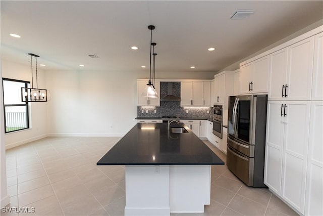 20341 Fair Oak Ln, Estero, FL 33928 - kitchen featuring appliances with stainless steel finishes, dark countertops, wall chimney exhaust hood, recessed lighting, and a chandelier