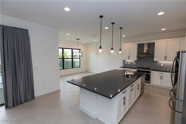 20341 Fair Oak Ln, Estero, FL 33928 - kitchen with wall chimney exhaust hood, freestanding refrigerator, a sink, dark countertops, and wall oven