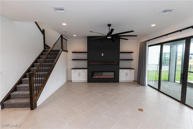 20341 Fair Oak Ln, Estero, FL 33928 - unfurnished living room featuring ceiling fan, light tile patterned floors, recessed lighting, a fireplace, and stairs