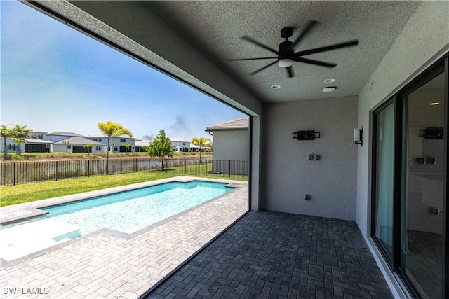 20341 Fair Oak Ln, Estero, FL 33928 - view of swimming pool with ceiling fan, a patio, and a residential view