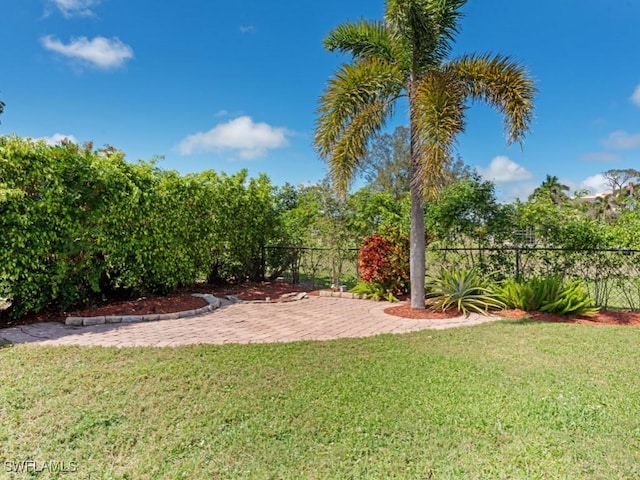 view of yard featuring a patio area and fence