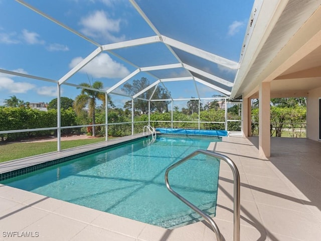 pool with a patio area and a lanai