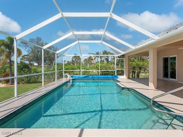 outdoor pool featuring a lanai and a patio