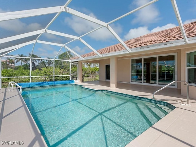 pool featuring a lanai and a patio area